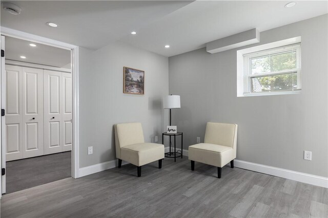 99 Scranton Ave, Warwick, RI 02888 - sitting room with wood finished floors, baseboards, and recessed lighting