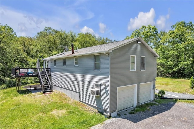 202 Hartford Pike, Foster, RI 02825 - view of side of property featuring stairway, a deck, an attached garage, a yard, and driveway