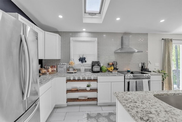 202 Hartford Pike, Foster, RI 02825 - kitchen featuring stainless steel appliances, wall chimney range hood, tasteful backsplash, white cabinetry, and recessed lighting