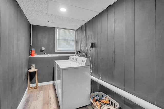 202 Hartford Pike, Foster, RI 02825 - washroom with washing machine and dryer, light wood-type flooring, baseboards, and wood walls