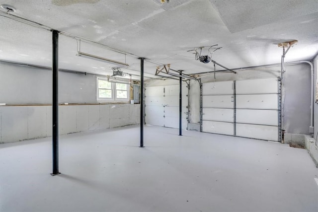202 Hartford Pike, Foster, RI 02825 - garage featuring a garage door opener and electric panel