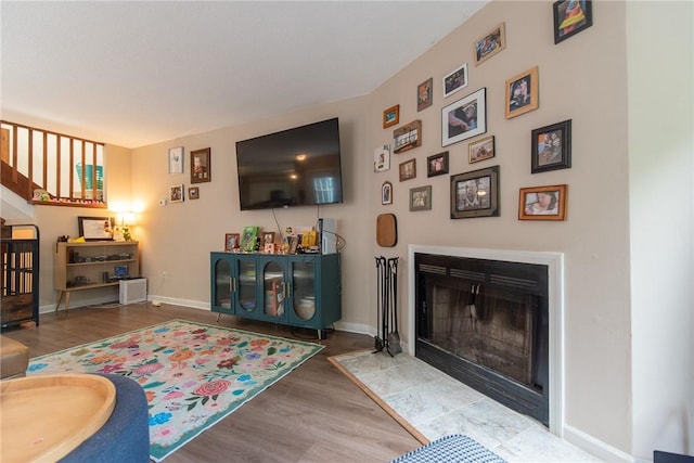 15 Loyalist Dr Unit 15B, Uxbridge, MA 01569 - living room with wood finished floors, a fireplace with flush hearth, and baseboards