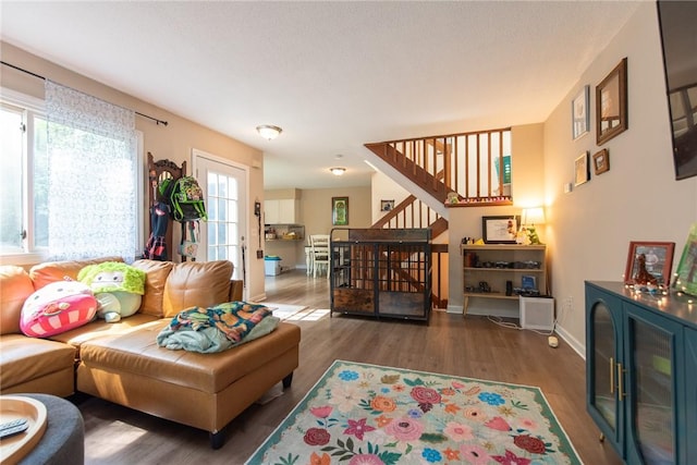 15 Loyalist Dr Unit 15B, Uxbridge, MA 01569 - living room with wood finished floors, stairway, and baseboards
