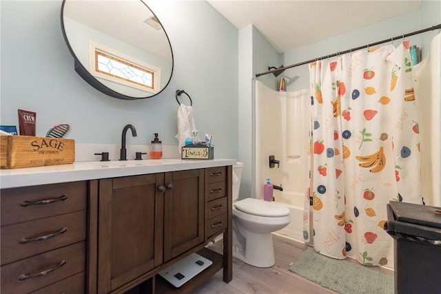 15 Loyalist Dr Unit 15B, Uxbridge, MA 01569 - bathroom with wood finished floors, vanity, shower / tub combo with curtain, and toilet