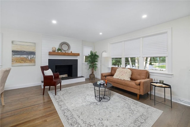 7 Nichols Rd, South Kingstown, RI 02881 - living area with wood finished floors, a fireplace, baseboards, and recessed lighting