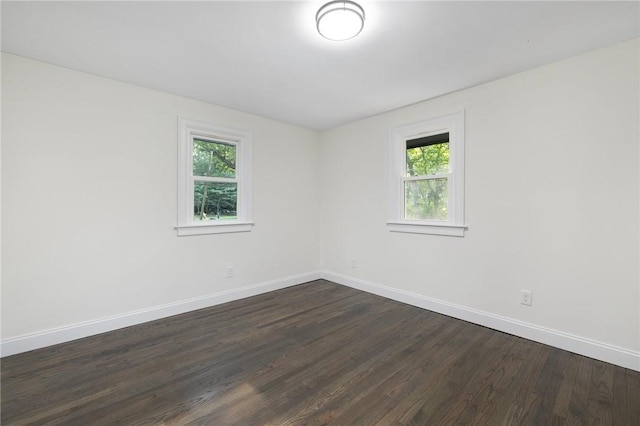 7 Nichols Rd, South Kingstown, RI 02881 - spare room with plenty of natural light, dark wood finished floors, and baseboards