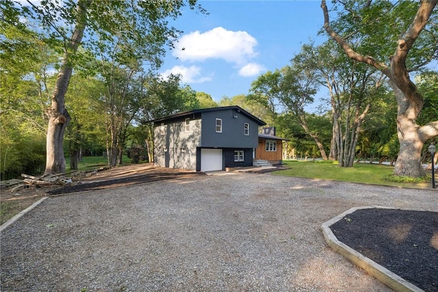 7 Nichols Rd, South Kingstown, RI 02881 - view of outbuilding with a garage and gravel driveway