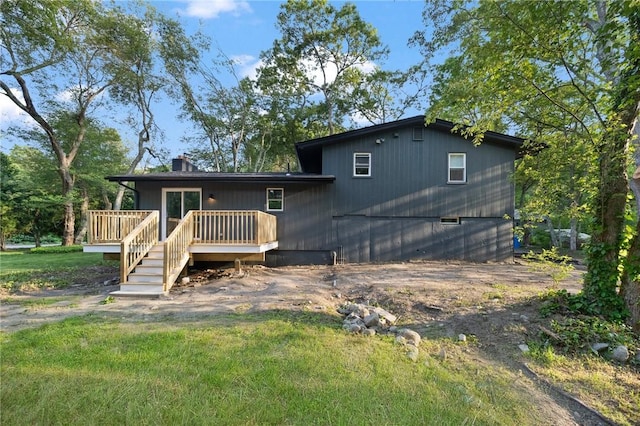 7 Nichols Rd, South Kingstown, RI 02881 - back of house with a deck and a chimney