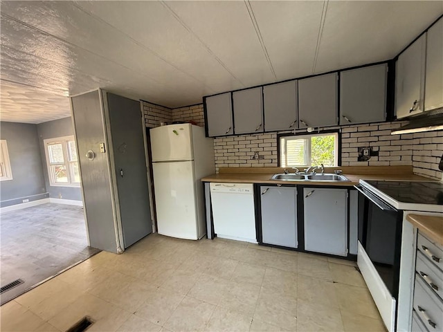6101 Post Rd, North Kingstown, RI 02852 - kitchen with white appliances, a sink, plenty of natural light, and ventilation hood