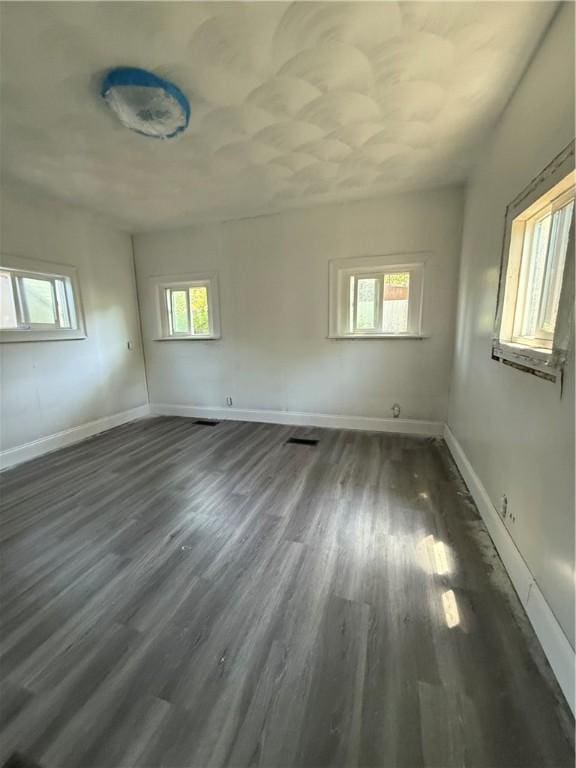 6101 Post Rd, North Kingstown, RI 02852 - spare room with dark wood finished floors and baseboards