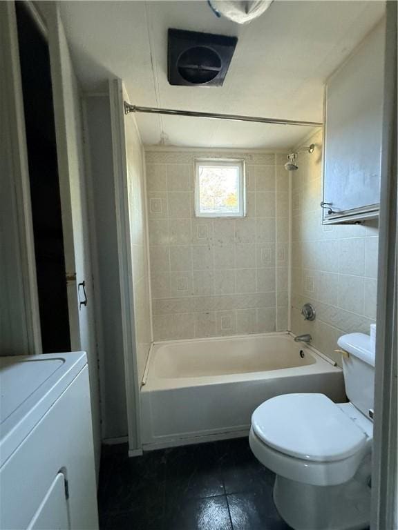 6101 Post Rd, North Kingstown, RI 02852 - bathroom featuring  shower combination, toilet, tile walls, tile patterned flooring, and washer / clothes dryer