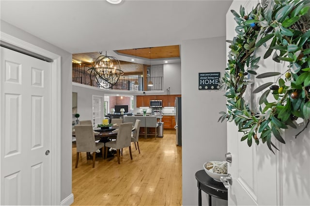 1 Tupperware Dr Unit 239, North Smithfield, RI 02896 - dining area with light wood-style floors and a chandelier