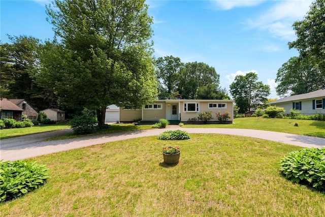 7 Stuart St, Westerly, RI 02891 - ranch-style house with curved driveway and a front lawn