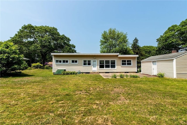 7 Stuart St, Westerly, RI 02891 - back of house with a yard, an outdoor structure, crawl space, and entry steps