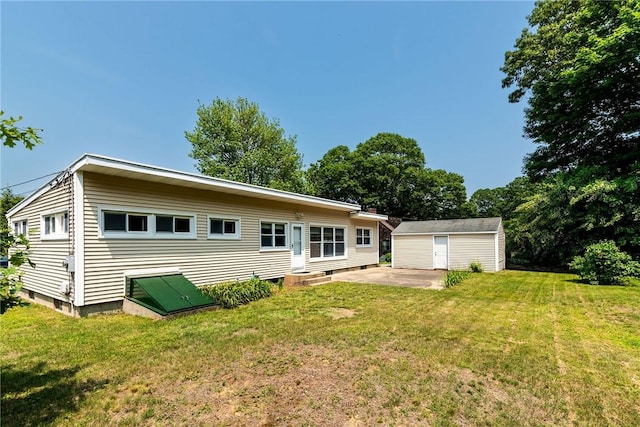 7 Stuart St, Westerly, RI 02891 - back of house featuring an outdoor structure, a yard, and a patio