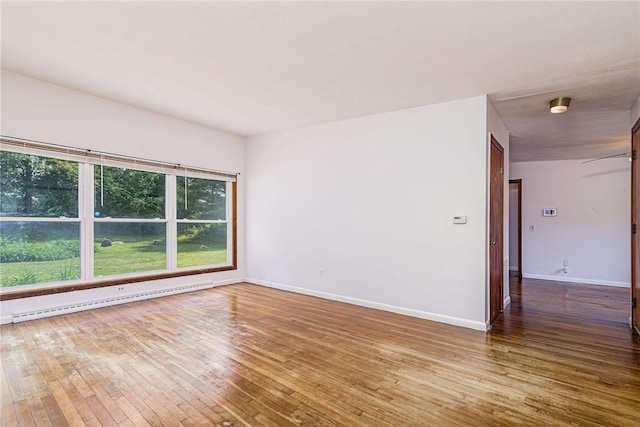 7 Stuart St, Westerly, RI 02891 - spare room with baseboard heating, hardwood / wood-style floors, and baseboards