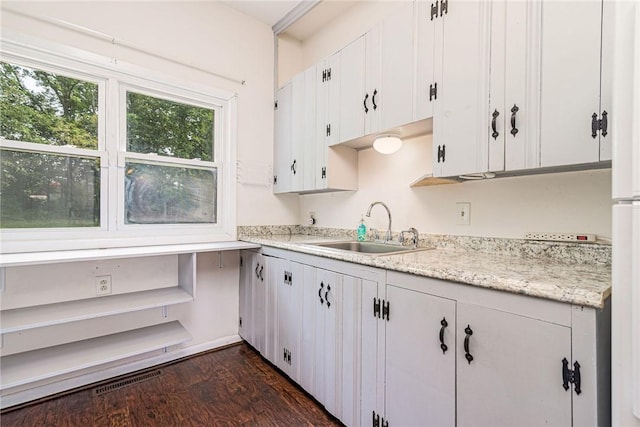 7 Stuart St, Westerly, RI 02891 - kitchen with a sink, dark wood-style flooring, and white cabinets