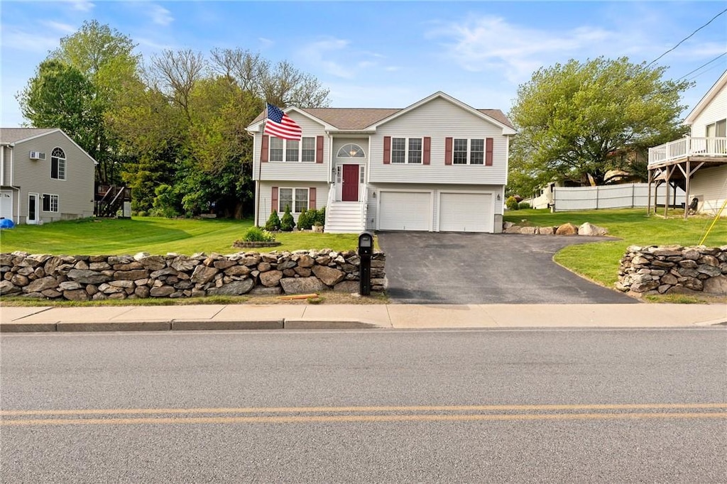 238 Wakefield St, West Warwick, RI 02893 - bi-level home featuring an attached garage and driveway