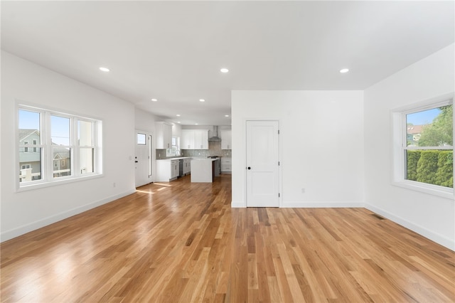 41 Burnett Rd, Warwick, RI 02889 - unfurnished living room featuring light wood-style flooring, baseboards, and recessed lighting