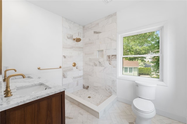 41 Burnett Rd, Warwick, RI 02889 - full bath with a tile shower, toilet, vanity, and baseboards