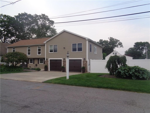 176 Vernon St, Warwick, RI 02889 - view of property featuring concrete driveway and an attached garage