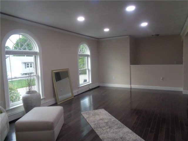 176 Vernon St, Warwick, RI 02889 - living area featuring dark wood-type flooring, baseboard heating, plenty of natural light, baseboards, and recessed lighting