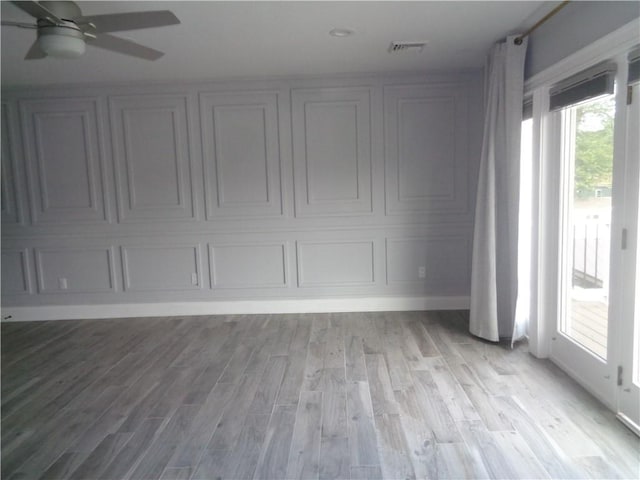 176 Vernon St, Warwick, RI 02889 - spare room featuring light wood finished floors, a ceiling fan, and baseboards