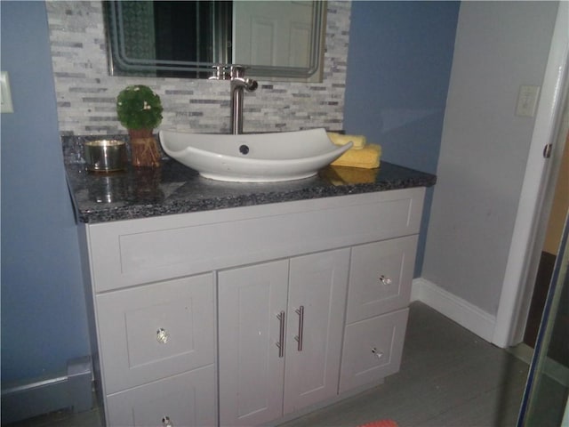 176 Vernon St, Warwick, RI 02889 - bathroom with backsplash, vanity, and baseboards