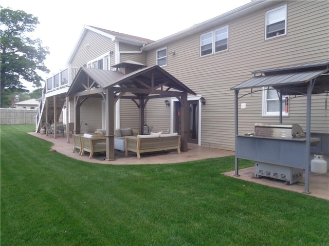 176 Vernon St, Warwick, RI 02889 - back of property with an outdoor hangout area, a gazebo, and a patio