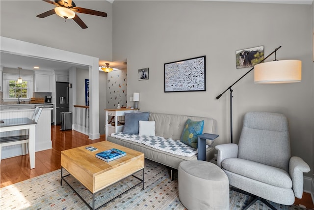 37 Brownell St, Warren, RI 02885 - living area with wood finished floors, a ceiling fan, baseboards, and a towering ceiling