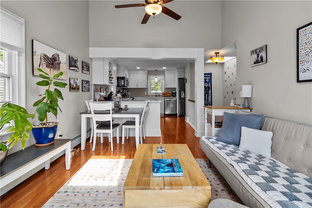 37 Brownell St, Warren, RI 02885 - living room featuring a ceiling fan, high vaulted ceiling, and wood finished floors