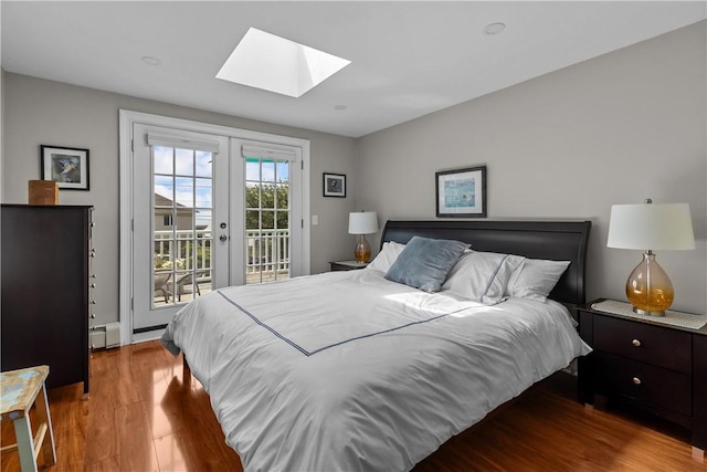 37 Brownell St, Warren, RI 02885 - bedroom featuring a skylight, access to outside, wood finished floors, french doors, and a baseboard radiator