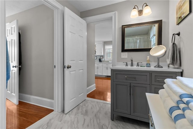 37 Brownell St, Warren, RI 02885 - bathroom featuring vanity, baseboards, and marble look tile flooring