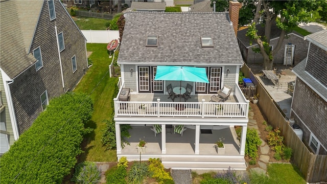 37 Brownell St, Warren, RI 02885 - back of property featuring outdoor dining area, a shingled roof, a patio, a fenced backyard, and a chimney