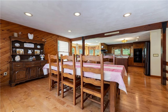 71 Phillips Ln, Glocester, RI 02814 - dining area with light wood-style floors, wooden walls, and recessed lighting