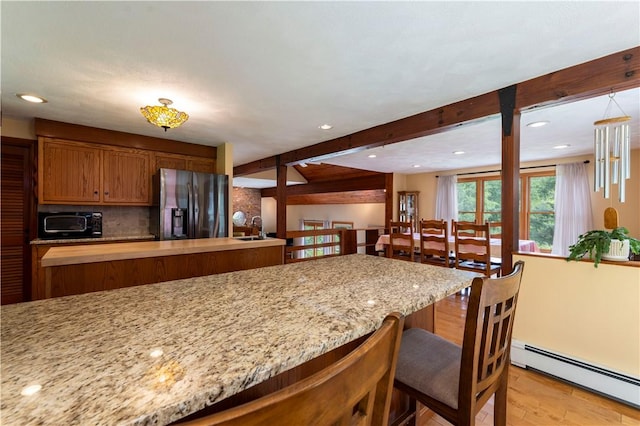71 Phillips Ln, Glocester, RI 02814 - kitchen with stainless steel fridge with ice dispenser, a baseboard radiator, light wood-style flooring, a kitchen bar, and beamed ceiling