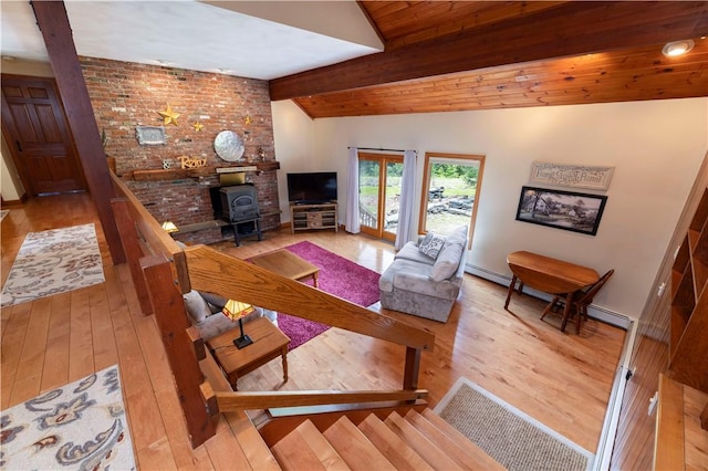 71 Phillips Ln, Glocester, RI 02814 - living area with hardwood / wood-style floors, a wood stove, and stairs