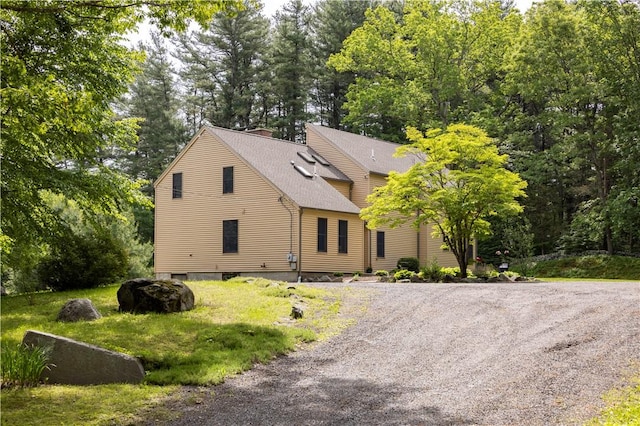 71 Phillips Ln, Glocester, RI 02814 - view of front of property featuring a shingled roof, gravel driveway, and a chimney