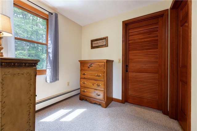 71 Phillips Ln, Glocester, RI 02814 - bedroom featuring a baseboard radiator, light colored carpet, a closet, and baseboards
