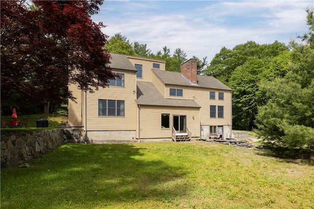 71 Phillips Ln, Glocester, RI 02814 - back of house with entry steps, a lawn, a chimney, and roof with shingles