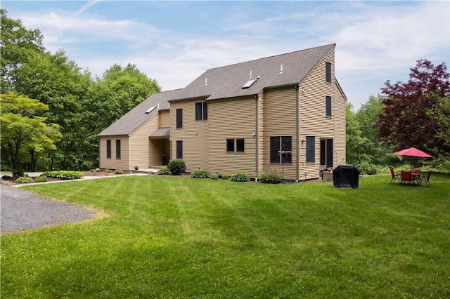 71 Phillips Ln, Glocester, RI 02814 - rear view of property featuring a yard and a shingled roof