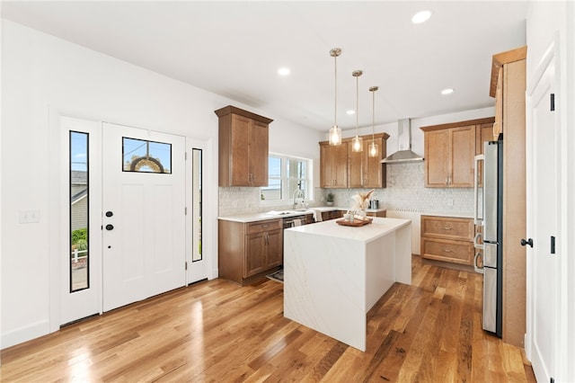 51 Burnett Rd, Warwick, RI 02889 - kitchen featuring wall chimney exhaust hood, a kitchen island, tasteful backsplash, stainless steel appliances, and recessed lighting