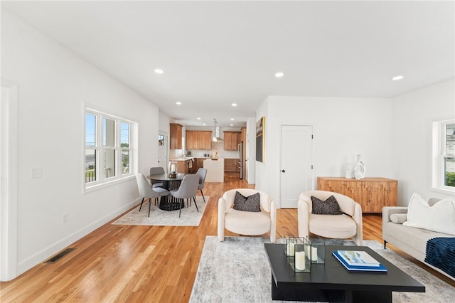 51 Burnett Rd, Warwick, RI 02889 - living room with healthy amount of natural light, recessed lighting, light wood-style floors, and baseboards