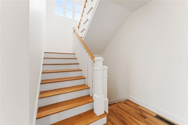 51 Burnett Rd, Warwick, RI 02889 - staircase featuring wood finished floors, baseboards, and vaulted ceiling