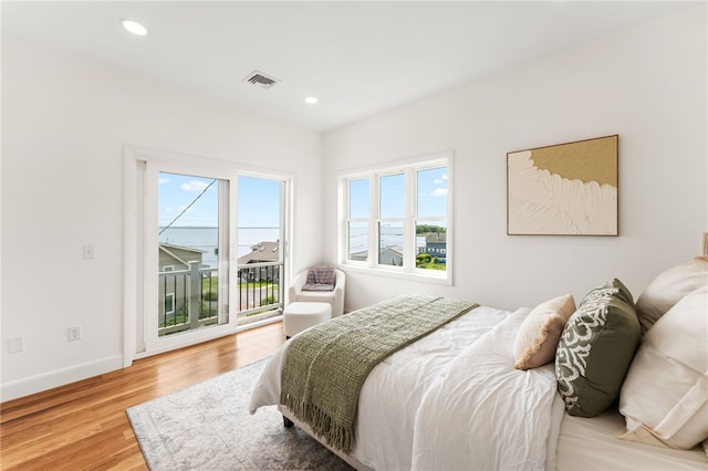 51 Burnett Rd, Warwick, RI 02889 - bedroom featuring access to outside, multiple windows, wood finished floors, recessed lighting, and baseboards