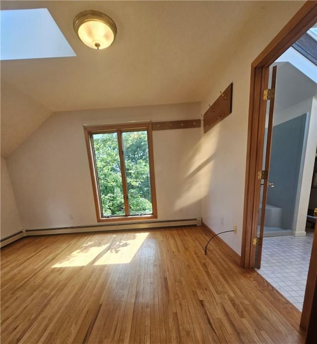 66 Shadbush Rd, South Kingstown, RI 02879 - additional living space with wood finished floors, lofted ceiling, and baseboards