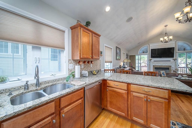 1421 Douglas Ave Unit E, North Providence, RI 02904 - kitchen featuring stainless steel dishwasher, a sink, a peninsula, a chandelier, and open floor plan