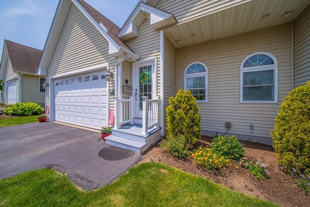 1421 Douglas Ave Unit E, North Providence, RI 02904 - view of front of property featuring driveway and a garage