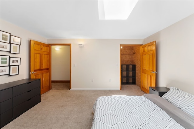 336 Switch Rd, Richmond, RI 02832 - bedroom with light colored carpet, a skylight, and baseboards
