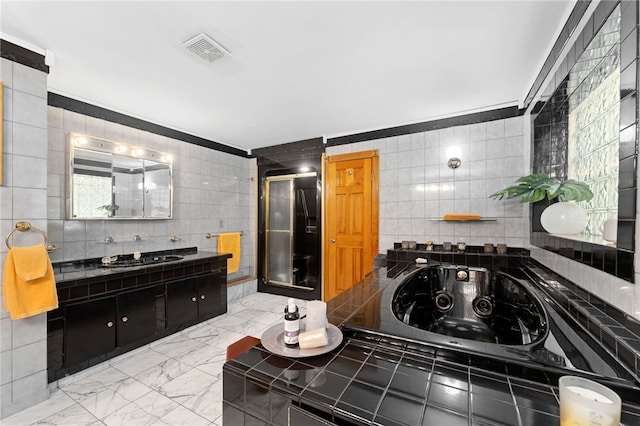 336 Switch Rd, Richmond, RI 02832 - bathroom featuring tile walls, a jetted tub, marble look tile flooring, vanity, and a stall shower